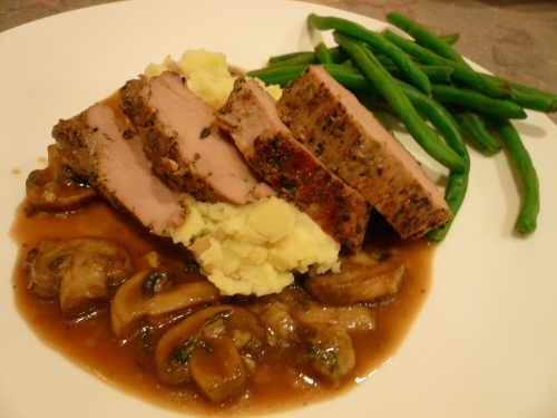 Roasted pork loin, mashed potatoes with mushroom gravy and green beans